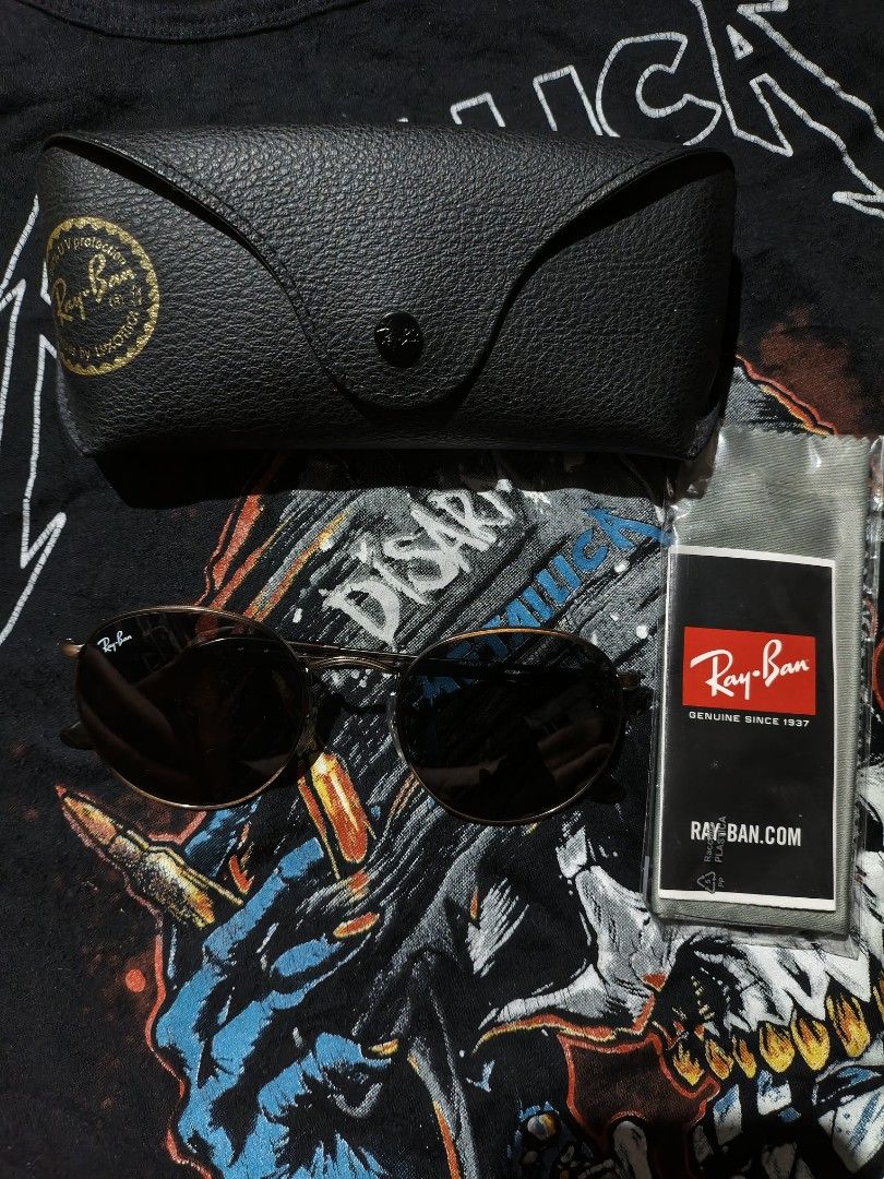 Ray-Ban round metal gold tone (Category: Sunglasses & Eyewear) located in Narvacan. Submitted by picky_looter (Listing ID 1416838929, Image 1). Description: The sunglasses in the image are the Ray-Ban RB3447 Round Metal model. This iconic style features a gold-tone metal frame and dark (G-15 green/grey) lenses. Key Features Style Name: Round Metal Model Number: RB3447 Frame Material: Metal, often stainless steel, for durability and a lightweight 