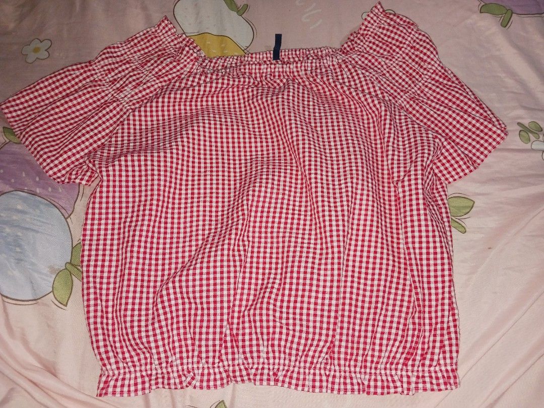Red Gingham Off-Shoulder Top (Category: Blouses) located in Naga. Submitted by havenaid (Listing ID 1416884916, Image 2). Description: - Classic red and white gingham pattern - Off-shoulder design - Short sleeves - Ruffled neckline and hem - Comfortable, gathered/elasticized fit - Dress up or down Classic off-shoulder gingham top in red and white. Features a garterized neckline and elastic hem, giving a comfy fit while still looking flattering. L