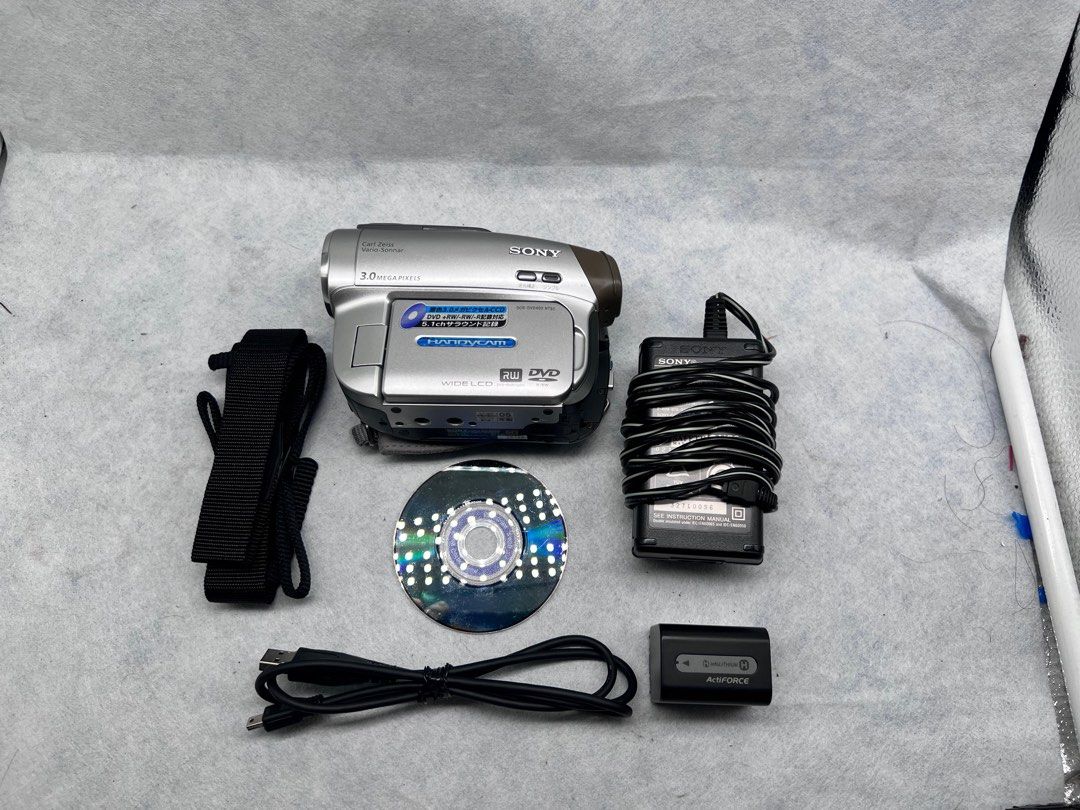 SONY DCR DVD-403 (Category: Video Cameras) located in Makati City. Submitted by maka-luma (Listing ID 1416953971, Image 3). Description: FULLY WORKING ✔️ Record ✔️ Fast Servo Zoom ✔️ Night Vision ✔️ Rewind ✔️ Pause/Stop ✔️ Fast forward ✔️ Color Viewfinder ✔️ Color LCD ✔️ Program AE ✔️ Disc eject ✔️ Picture flash ✔️ Diverse settings ₱7999 READY TO USE! 📹📼🔋Inclusions: Camera unit, Sony camera shoulder strap, Sony hand strap, Sony info-lithium M 