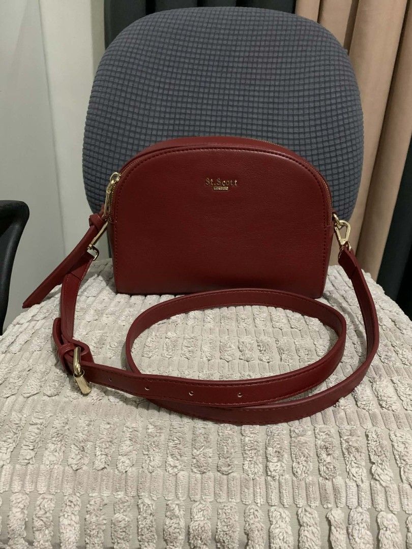 St. Scott London Crossbody Bag (Category: Cross-body Bags) located in Marikina City. Submitted by rafmorales (Listing ID 1416924664, Image 1). Description: ang pretty in person , unused. stored properly :) shadows lang po ang nasa hardwares good as new :) - original St. Scott London Crossbody Bag - Rich red color - Gold-toned hardware - Dual-zippered main compartment - Adjustable strap - Minimalist design - Stylish and practical for everyday use.