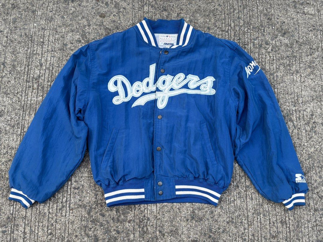 Starter Los Angeles Dodgers Jacket (Category: Coats, Jackets and Outerwear) located in Malabon City. Submitted by rssll30 (Listing ID 1416952266, Image 1). Description: - Vintage Starter jacket - Features the Los Angeles Dodgers logo - "NOMO" detail on the sleeve - Button-up front - Striped cuffs and collar - Includes patches inside (Nomu, Kirin Beverage) - Color: Blue with white accents.