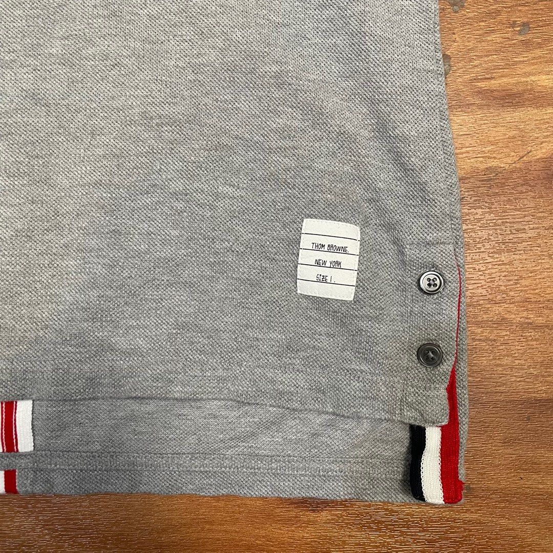 Thom browne back stripe shirt (Category: Luxury Apparel) located in Quezon City. Submitted by giveme_theloot (Listing ID 1416933176, Image 2). Description: Available for purchase in-store or online Thom browne back stripe shirt Condition : 9/10 Size : 1 Dimes : Width - 18 1/2” Length - 24 1/2” Back Length - 26 1/2” Price : 5,000 php or drop best offer.