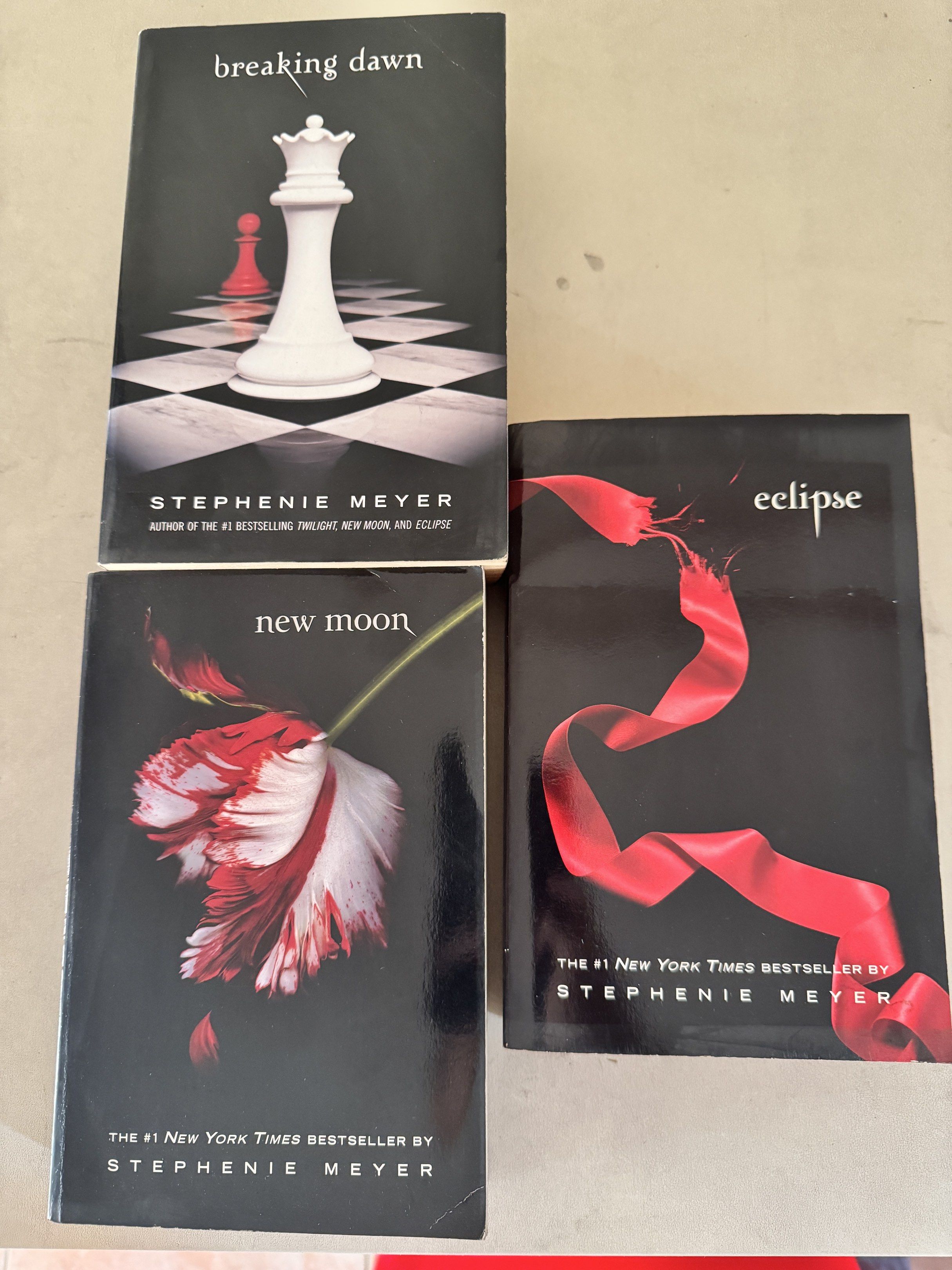 Twilight Saga Books by Stephenie Meyer (Category: Storybooks) located in Quezon City. Submitted by harristhegoldenboy (Listing ID 1417024302, Image 2). Description: - Twilight Saga book set - Includes "Breaking Dawn", "New Moon", and "Eclipse" - Published by Little Brown - Features iconic cover art - Perfect for Twilight fans RFS decluttering.