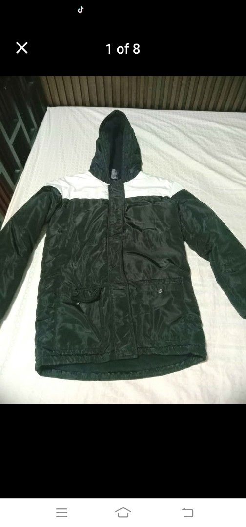 Winter Tilt Black Jacket with Hood (Category: Coats, Jackets and Outerwear) located in Mandaluyong City. Submitted by ireneipt_21 (Listing ID 1416986575, Image 1). Description: Unisex. Bought from Australia. Used. In very good condition. A puffy jacket..