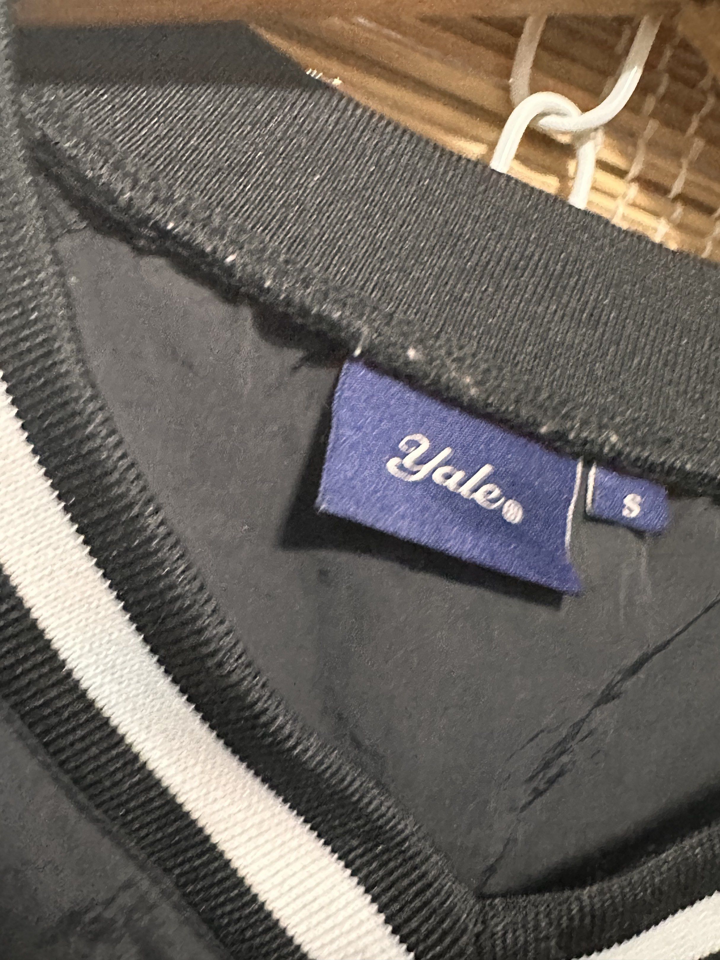 Yale Black Jacket - Size S (Category: Coats, Jackets and Outerwear) located in Manila. Submitted by 404archive_ (Listing ID 1416880670, Image 2). Description: - Yale black jacket - Size: S - Design: V-neck with white stripes on collar - Material: Smooth, possibly nylon-like - Features Yale brand label.