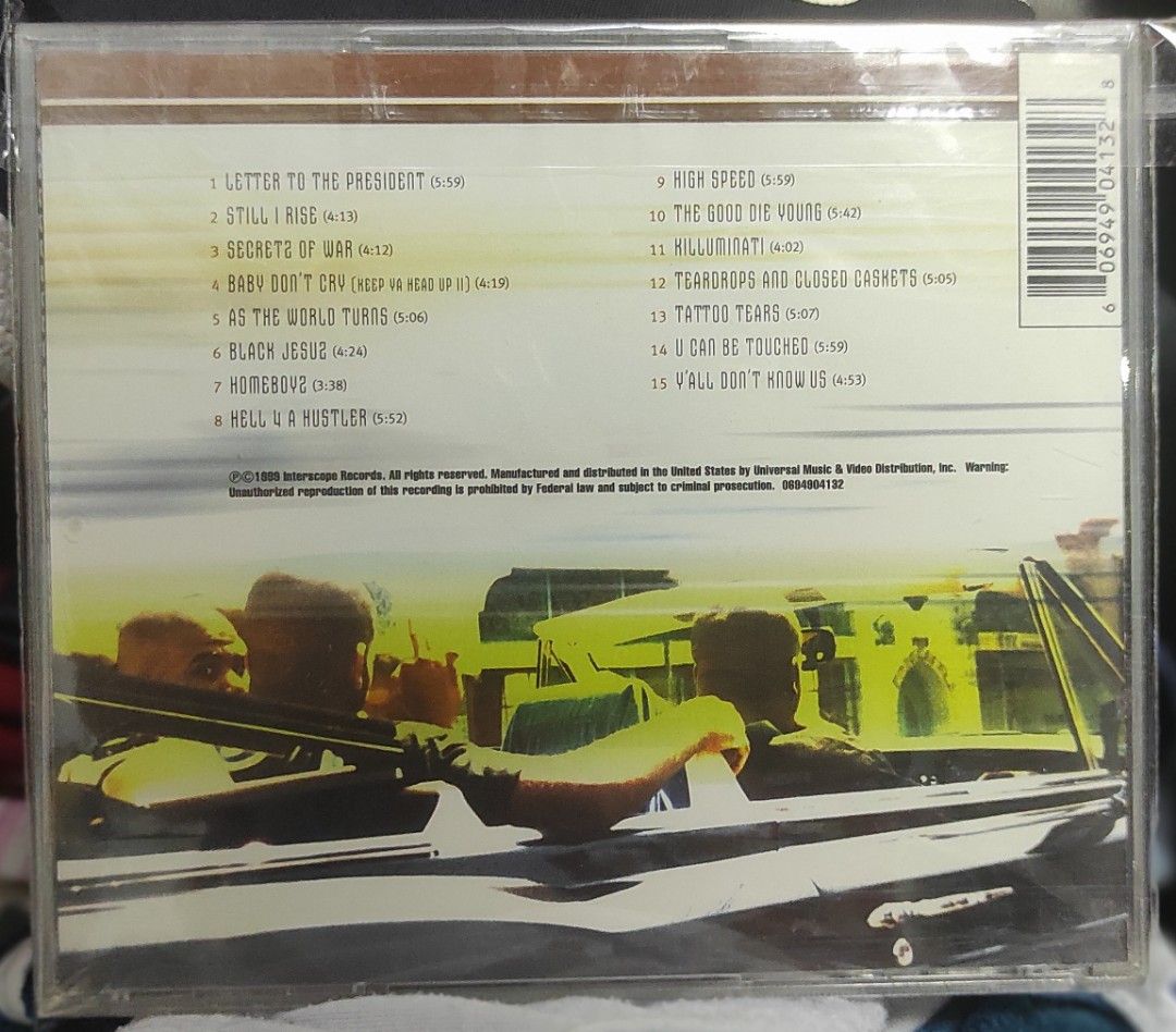 2Pac + Outlawz - Still I Rise CD (Category: CDs & DVDs) located in Manila. Submitted by trickdc (Listing ID 1417140889, Image 2). Description: Original CD of 2Pac and Outlawz's album "Still I Rise". Features tracks like "Letter to the President", "Still I Rise", and "Baby Don't Cry". The CD is in its original packaging. The back of the CD case shows the tracklist and copyright information. A must-have for any 2Pac fan..
