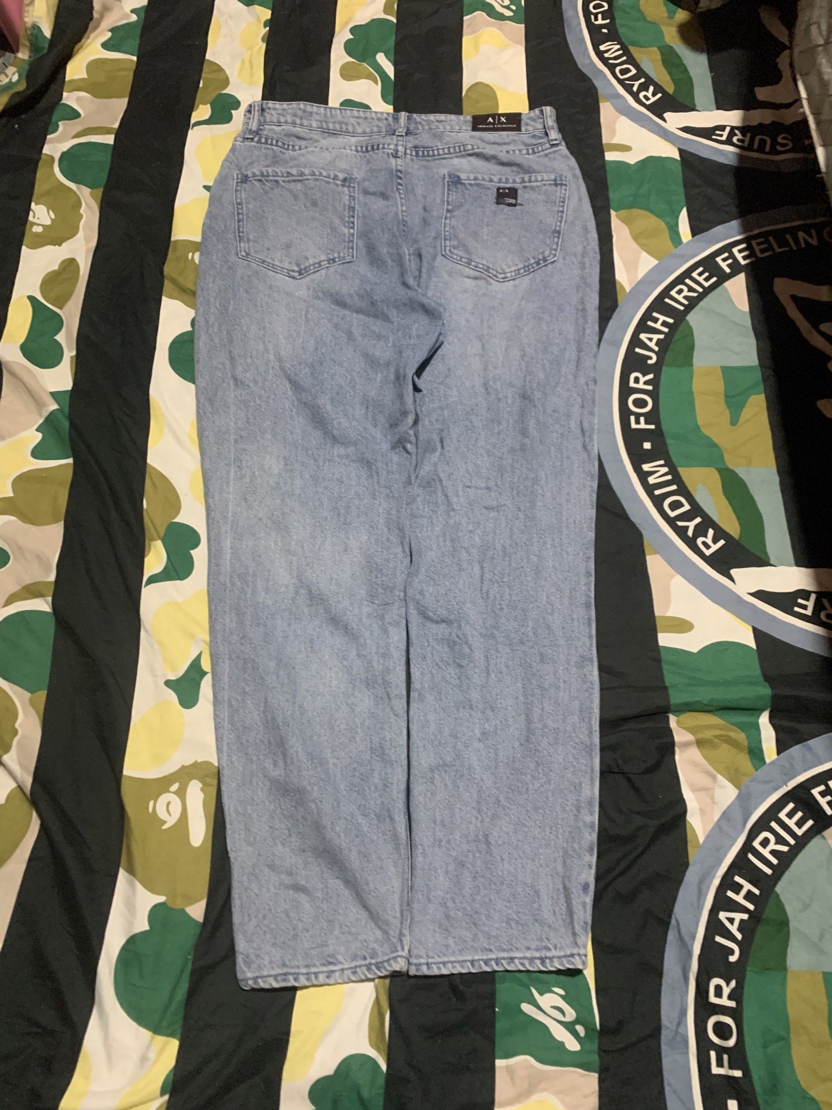 Armani Exchange Boyfriend Jeans Size 28 (Category: Luxury Apparel) located in Cagayan de Oro. Submitted by agboysalis60090 (Listing ID 1417063070, Image 2). Description: Armani Exchange boyfriend jeans in light blue. Features a button closure with the Armani Exchange logo. The jeans have a size 28 waist. The back of the jeans has the Armani Exchange logo. The jeans are made of 100% cotton. There is a small stain on the front of the jeans..