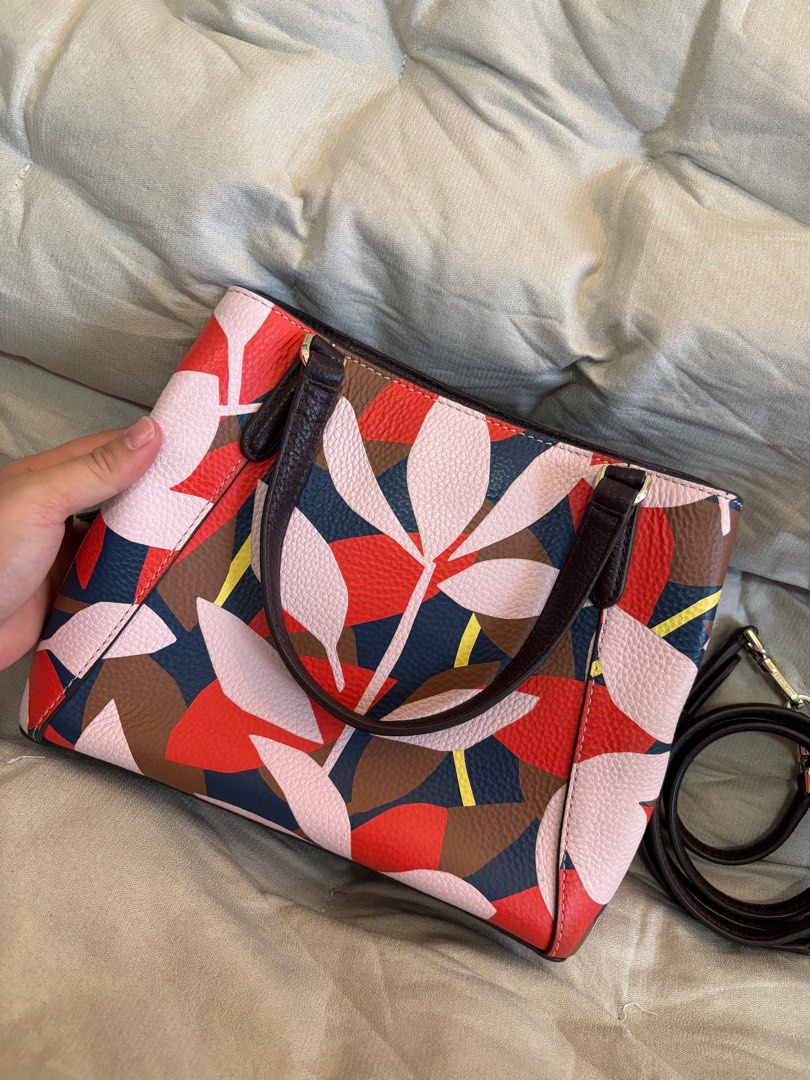 Authentic Kate Spade Mini Satchel - Handbag & Shoulder Bag (Category: Shoulder Bags) located in Makati City. Submitted by declutterwithmeeeee (Listing ID 1417184234, Image 3). Description: Original Kate Spade New York mini satchel featuring a discontinued graphic floral/leaf print. Only used twice and mostly stored in a cabinet, hence still in very good to near-excellent condition (4.5/5). ✔ 100% authentic ✔ Made in Vietnam ✔ Original spade linin