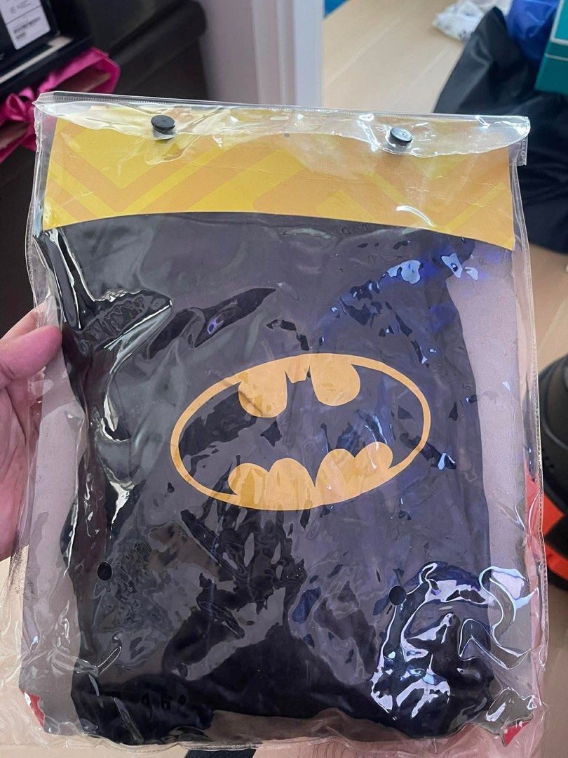 Batman Girl Costume (Category: Babies & Kids Fashion) located in San Pedro. Submitted by goodstogoph (Listing ID 1417030186, Image 2). Description: - Batman girl costume with mask and one-piece garment - Features the iconic Batman logo - sizes: M (120-130CM) 3-4yo - Packaged in a clear plastic bag RFS: tried on, stored and never used. Decluttering. .