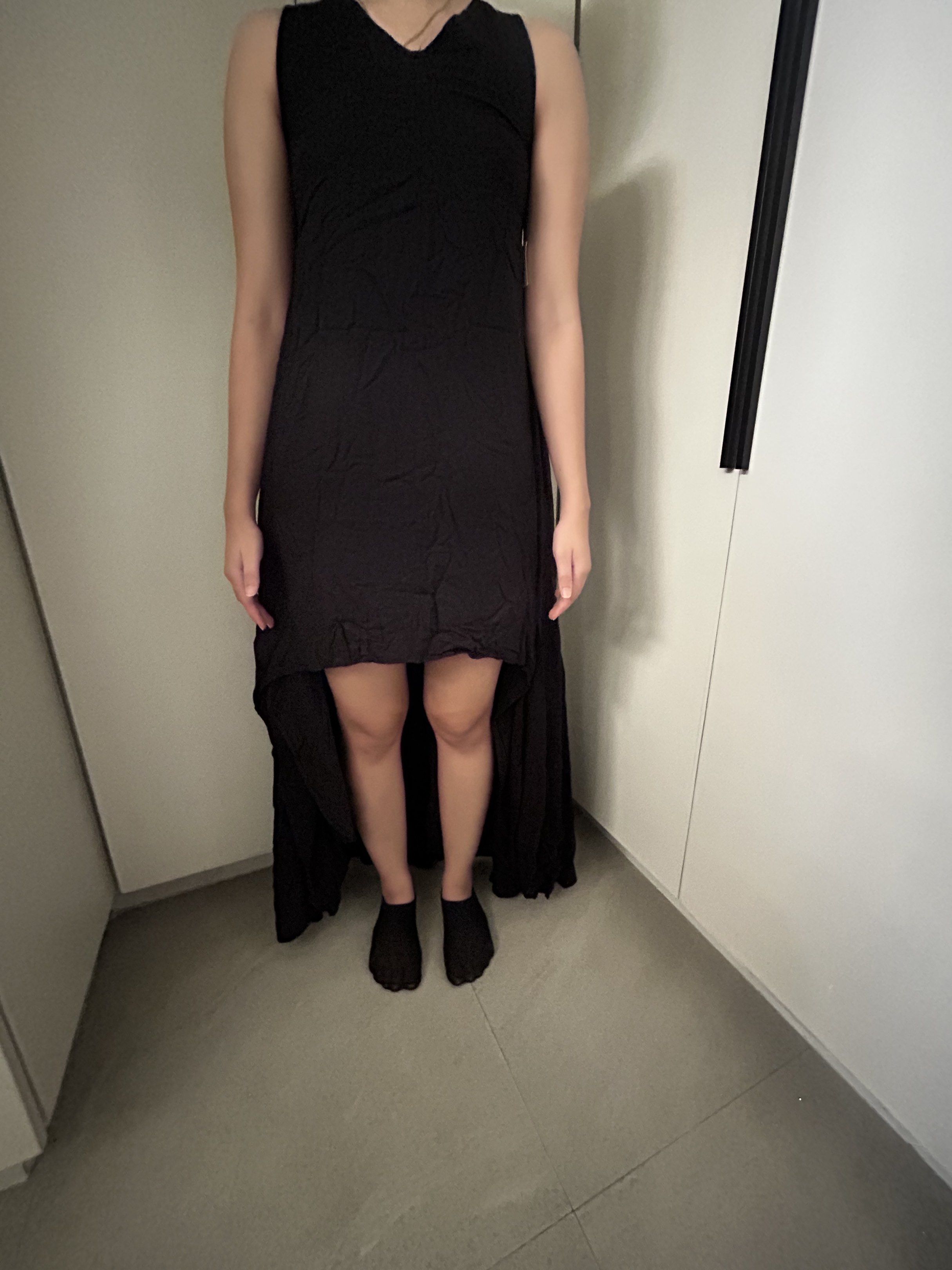 Black Sleeveless High-Low Dress (Category: Dresses) located in Quezon City. Submitted by rochelle__ (Listing ID 1417138435, Image 2). Description: Elegant black dress with a unique high-low hemline. Features a sleeveless design with a V-neck. The back of the dress has a crochet detail. Perfect for special occasions or a night out. The dress has a flowing, comfortable fit. It is a versatile piece that can be dressed up or down..