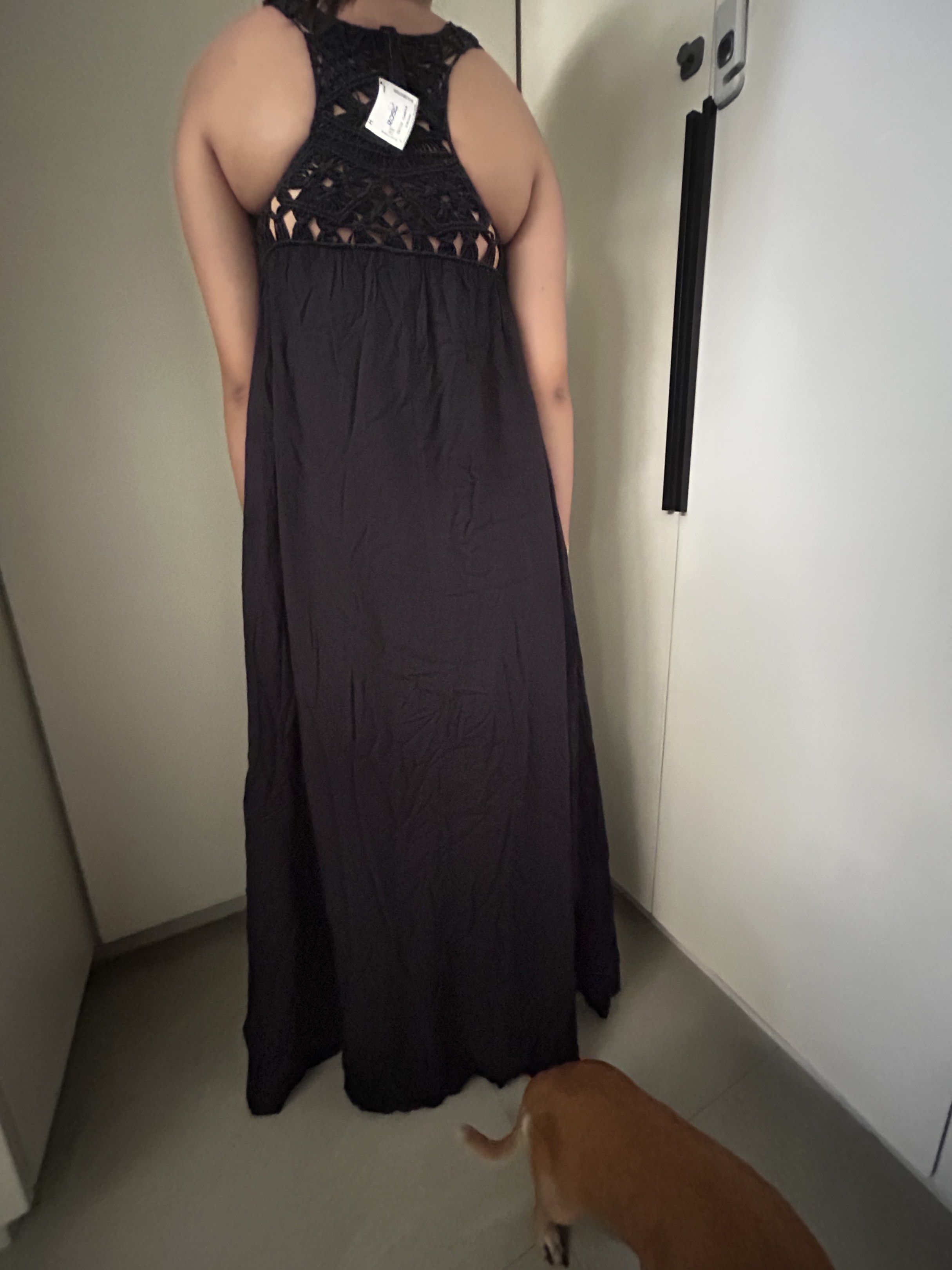 Black Sleeveless High-Low Dress (Category: Dresses) located in Quezon City. Submitted by rochelle__ (Listing ID 1417138435, Image 3). Description: Elegant black dress with a unique high-low hemline. Features a sleeveless design with a V-neck. The back of the dress has a crochet detail. Perfect for special occasions or a night out. The dress has a flowing, comfortable fit. It is a versatile piece that can be dressed up or down..