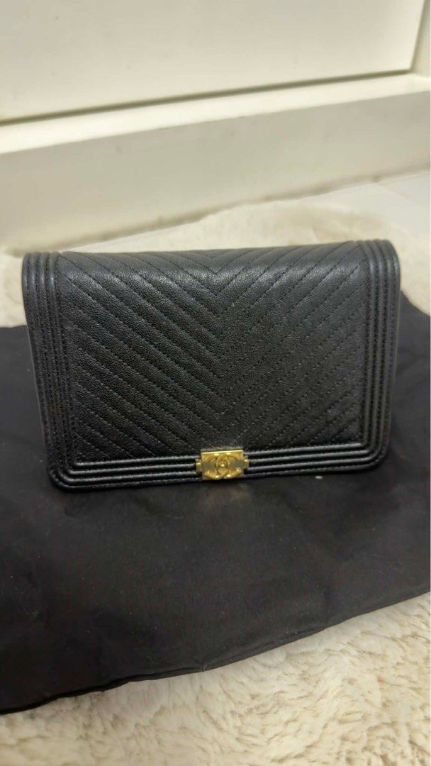 Chanel Boy Wallet on Chain Black (Category: Luxury Bags & Wallets) located in Arayat. Submitted by cjscolis (Listing ID 1417173369, Image 1). Description: - Authentic Chanel Boy Wallet on Chain - Black chevron-quilted design - Features a gold chain strap - Iconic CC logo on flap closure - Multiple interior compartments (card slots, zippered pocket) SLIGHTLY NEGOTIABLE - Comes with dust bag and authenticity card .