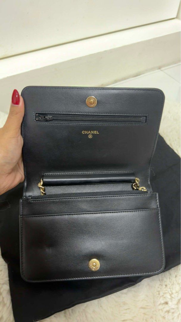 Chanel Boy Wallet on Chain Black (Category: Luxury Bags & Wallets) located in Arayat. Submitted by cjscolis (Listing ID 1417173369, Image 2). Description: - Authentic Chanel Boy Wallet on Chain - Black chevron-quilted design - Features a gold chain strap - Iconic CC logo on flap closure - Multiple interior compartments (card slots, zippered pocket) SLIGHTLY NEGOTIABLE - Comes with dust bag and authenticity card .