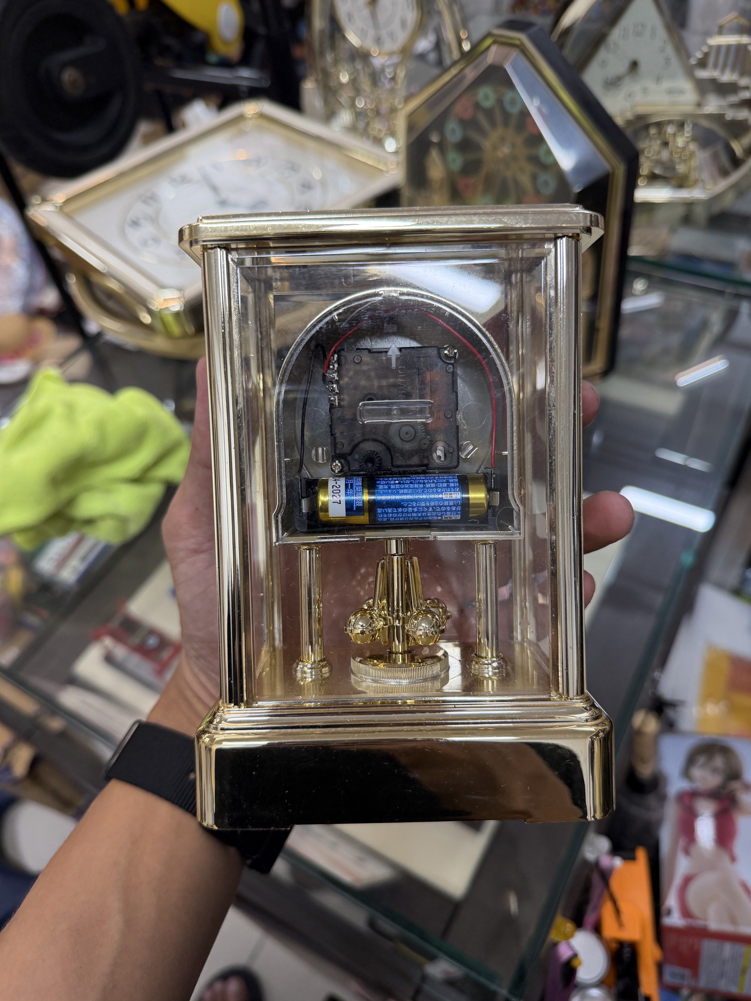 Citizen Quartz Clock (Category: Clocks) located in Makati City. Submitted by japankycollection (Listing ID 1417173164, Image 2). Description: - Citizen quartz clock - Gold-colored frame and clock face - Clear glass enclosure - Roman numeral display - Features a pendulum - Battery-operated - Rectangular shape - Includes Citizen label TESTED WORKING.