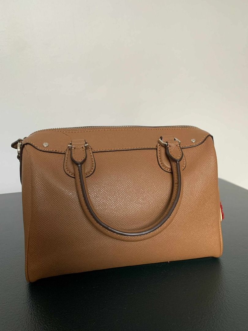 Coach Brown Leather Motif Shoulder Bag (Category: Luxury Bags & Wallets) located in Pasig City. Submitted by sc0f1eld (Listing ID 1417204453, Image 2). Description: Size: Height: 16CM, Length: 23CM Handle Drop: 8CM Shoulder Drop: 50CM (Adjustable) Material: Leather Minor cracks on some leather parts near the handle (see photos 6–10 for details). Location: High Street South, Pasig or Mayamot Antipolo Buyer will shoulder the delivery fee.