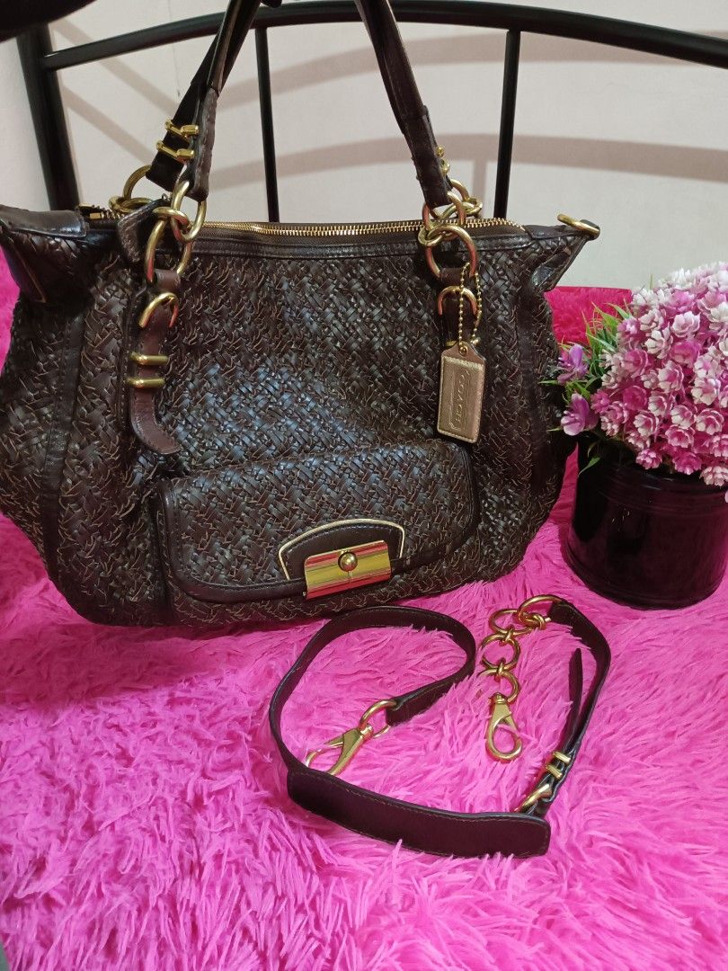 Coach Brown Woven Leather Handbag (Category: Luxury Bags & Wallets) located in Digos. Submitted by chihanu (Listing ID 1417036625, Image 1). Description: - Authentic Coach handbag - Brown woven leather - Top zipper closure - Front pocket with clasp - Gold-tone hardware - Detachable shoulder strap - Coach hangtag included - Double top handles - Interior Coach label.