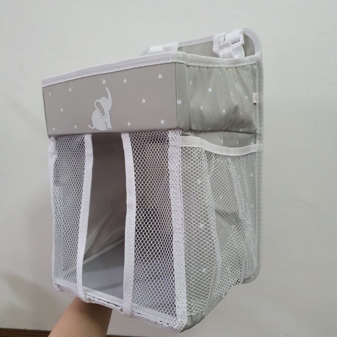 Collapsible diaper caddy baby needs organizer (Category: Other Baby Bathing & Changing Needs) located in Paranaque City. Submitted by cobien (Listing ID 1417210613, Image 1). Description: - Collapsible Diaper Caddy - Gray color with elephant design - Foldable for easy storage - Includes changing pad - the plastic packaging is damaged - Multiple compartments for organization.