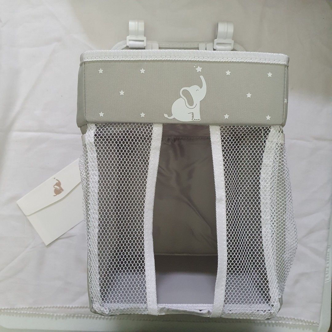 Collapsible diaper caddy baby needs organizer (Category: Other Baby Bathing & Changing Needs) located in Paranaque City. Submitted by cobien (Listing ID 1417210613, Image 2). Description: - Collapsible Diaper Caddy - Gray color with elephant design - Foldable for easy storage - Includes changing pad - the plastic packaging is damaged - Multiple compartments for organization.