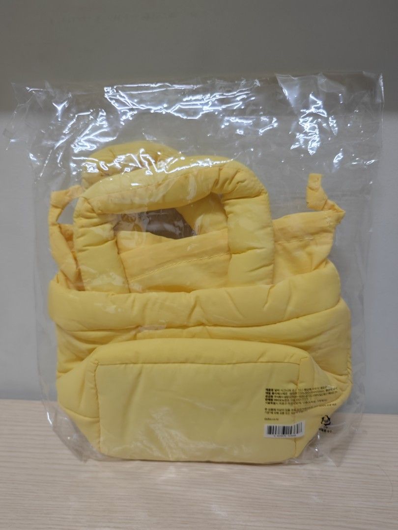 d'Alba Yellow Handbag (Category: Tote Bags) located in Taguig. Submitted by hellojuly (Listing ID 1417092153, Image 3). Description: - Brand: d'Alba - Color: Yellow - Closure: Drawstring - Features: Padded handle - Condition: Brand new, in plastic wrapping RFS: extra *Opened bag in picture is personal use.