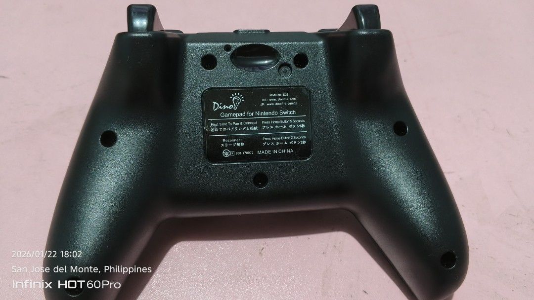 Dinofire wireless gamepad. (Category: Controllers) located in San Jose del Monte. Submitted by hacknburn (Listing ID 1417128865, Image 2). Description: Pro Controller. The controller features motion control, dual motor vibration, and a turbo function. It uses a USB Type-C charging cable. It does not include the amiibo function or the ability to wake the Switch from sleep mode opened box for testing only if interested DM me :) pickup shipping thro