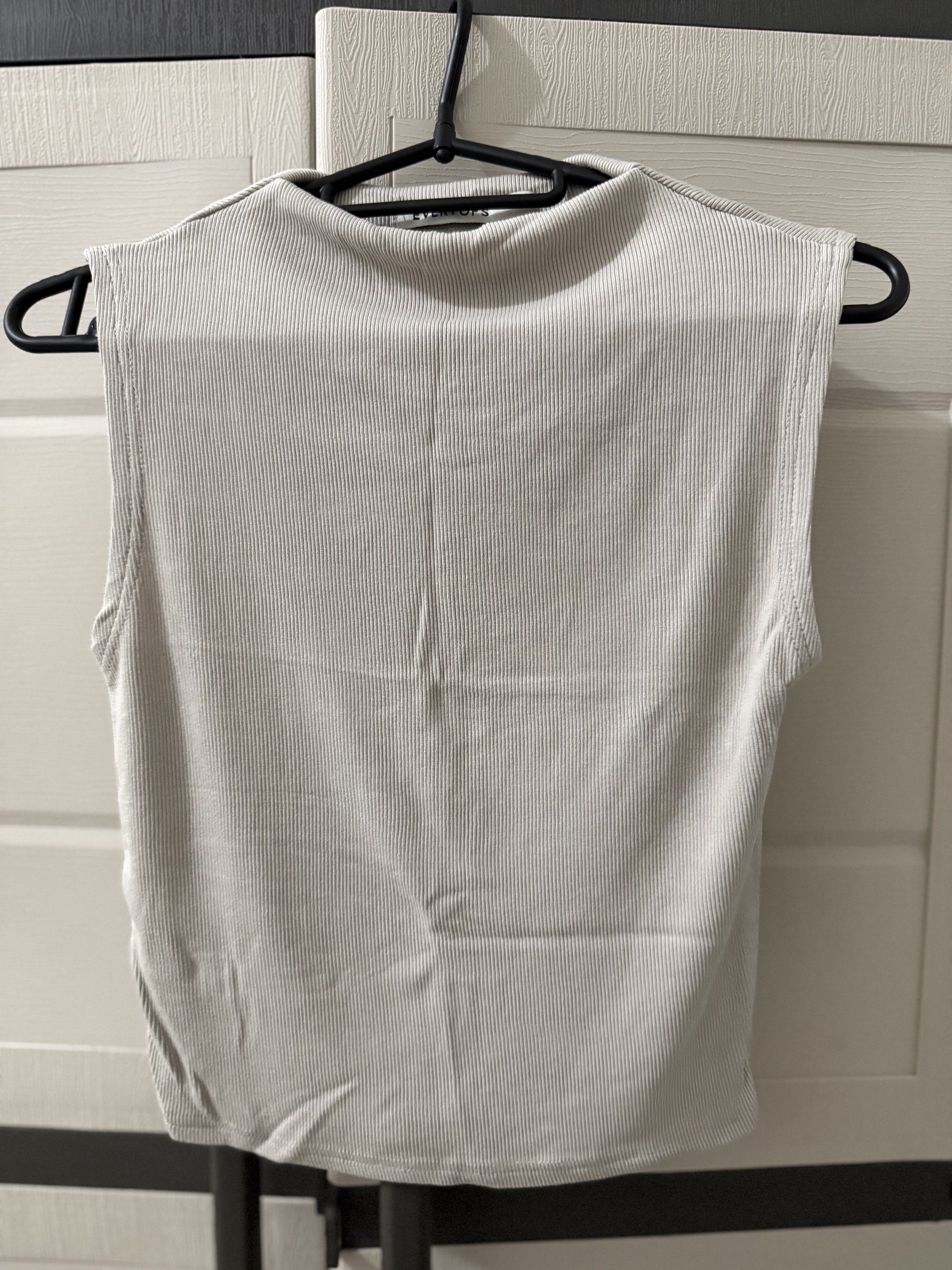 Evertops Ribbed Top (Asa Top) - Size L (Category: Sleeveless) located in Manila. Submitted by ivelllllllll (Listing ID 1417152064, Image 1). Description: - Ever Tops ribbed top - Size: L - Sleeveless design - Features a mock neck - Oat color -Never used RFS: Decluttering.