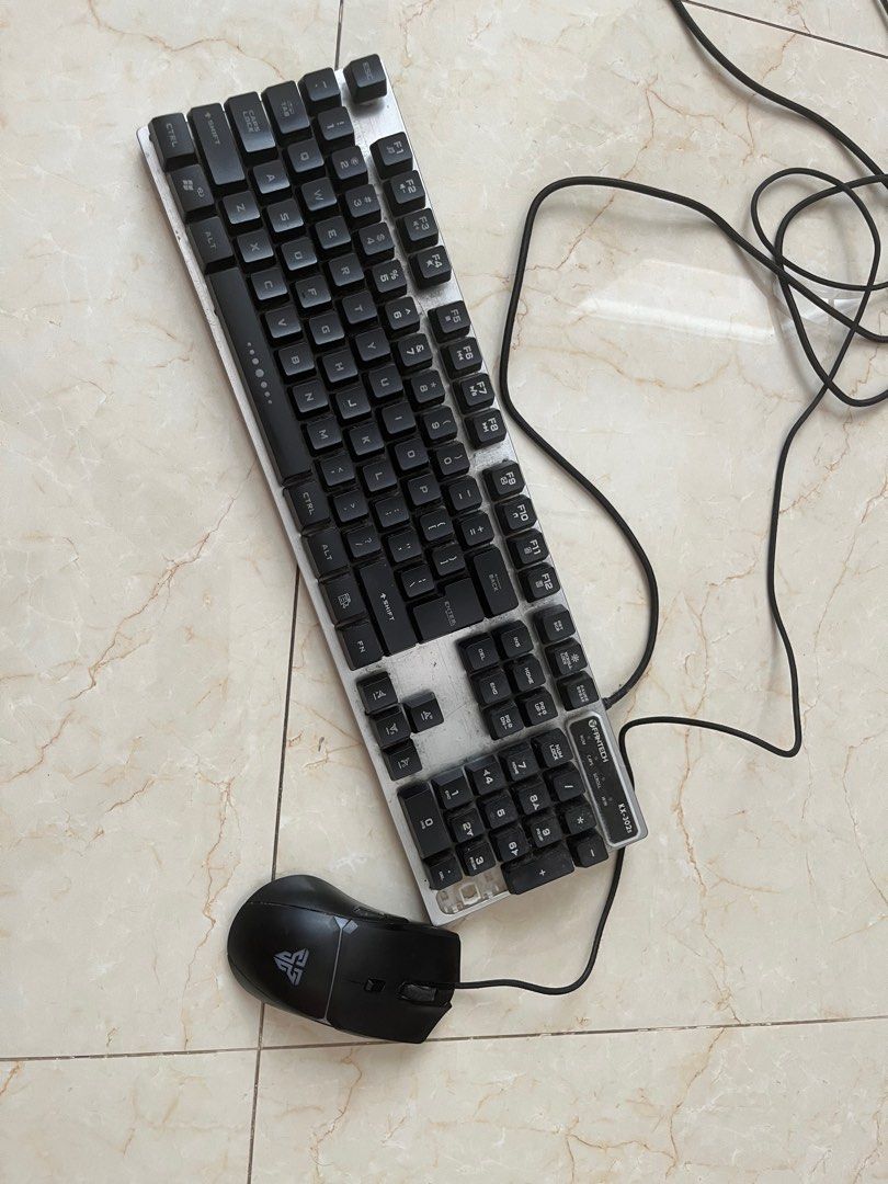 Fantech keyboard and mouse (Category: Computer Keyboard) located in Muntinlupa City. Submitted by snbthriftz (Listing ID 1417096909, Image 1). Description: works perfectly fine only issue is a lose ke negotiable .