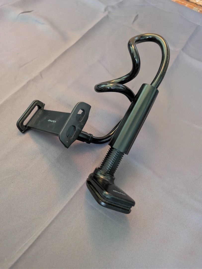 Flexible Gooseneck Phone Holder (Category: Mounts & Holders) located in Quezon City. Submitted by trainforless (Listing ID 1417140763, Image 1). Description: Flexible gooseneck phone holder is designed to securely hold your phone. It features a sturdy clamp to attach to various surfaces and a flexible arm for easy adjustment. It allows for hands-free use of your phone, perfect for watching videos or video calls..
