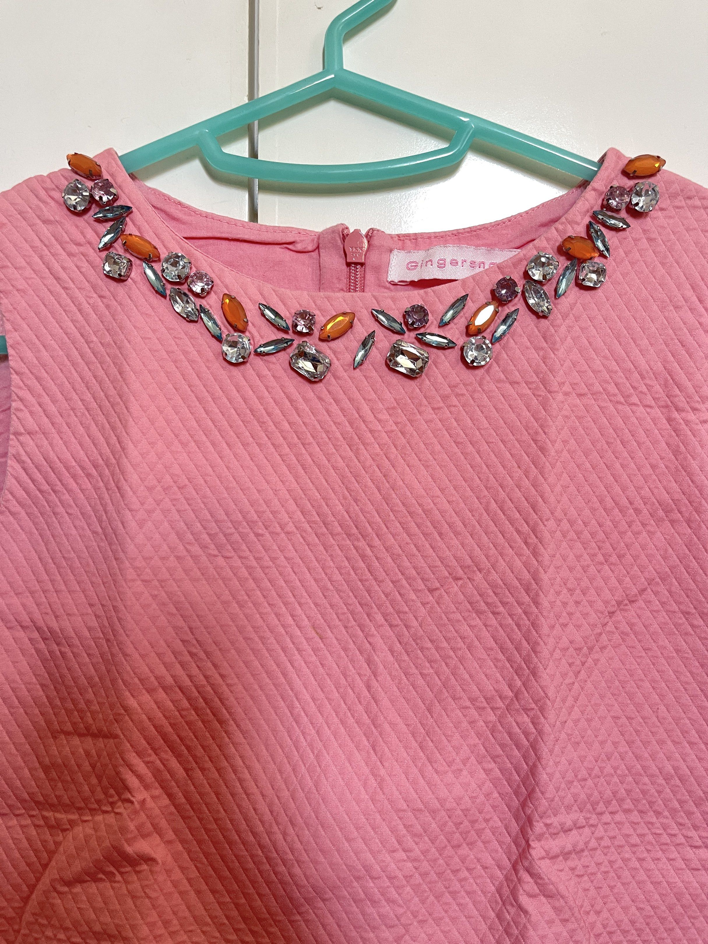 Gingersnaps - Kids Embellished Pink Top (Category: Babies & Kids Fashion) located in Manila. Submitted by closetlibraryph (Listing ID 1417090554, Image 2). Description: - Gingersnaps pink top - Unique quilted texture - Round neckline with sparkling embellishments - Sleeveless design - Stylish peplum hem - Back zipper closure - Perfect for a touch of elegance.