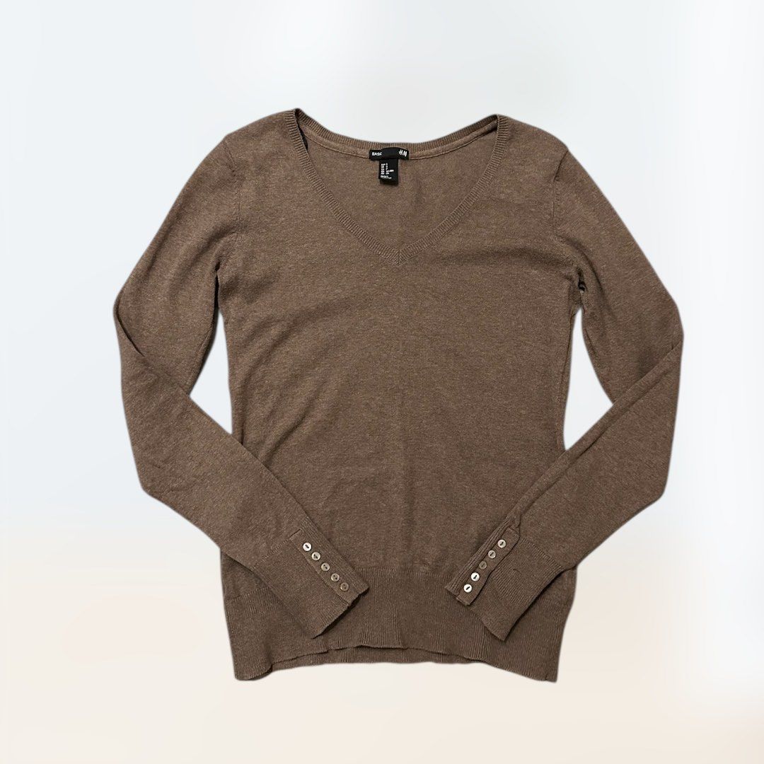 H&M Ladies V-Neck Sweater with Button Cuffs (Category: Longsleeves) located in Pasig City. Submitted by funhuntr (Listing ID 1417098208, Image 3). Description: - H&M V-neck sweater - Classic design, perfect for layering for travel or office - Long sleeves with button details on sweater cuff - Soft cocoa brown color - Knit fabric with a hint of stretch - Suitable for various occasions Dimensions Width across 16in Length from shoulder to hem 22.5in
