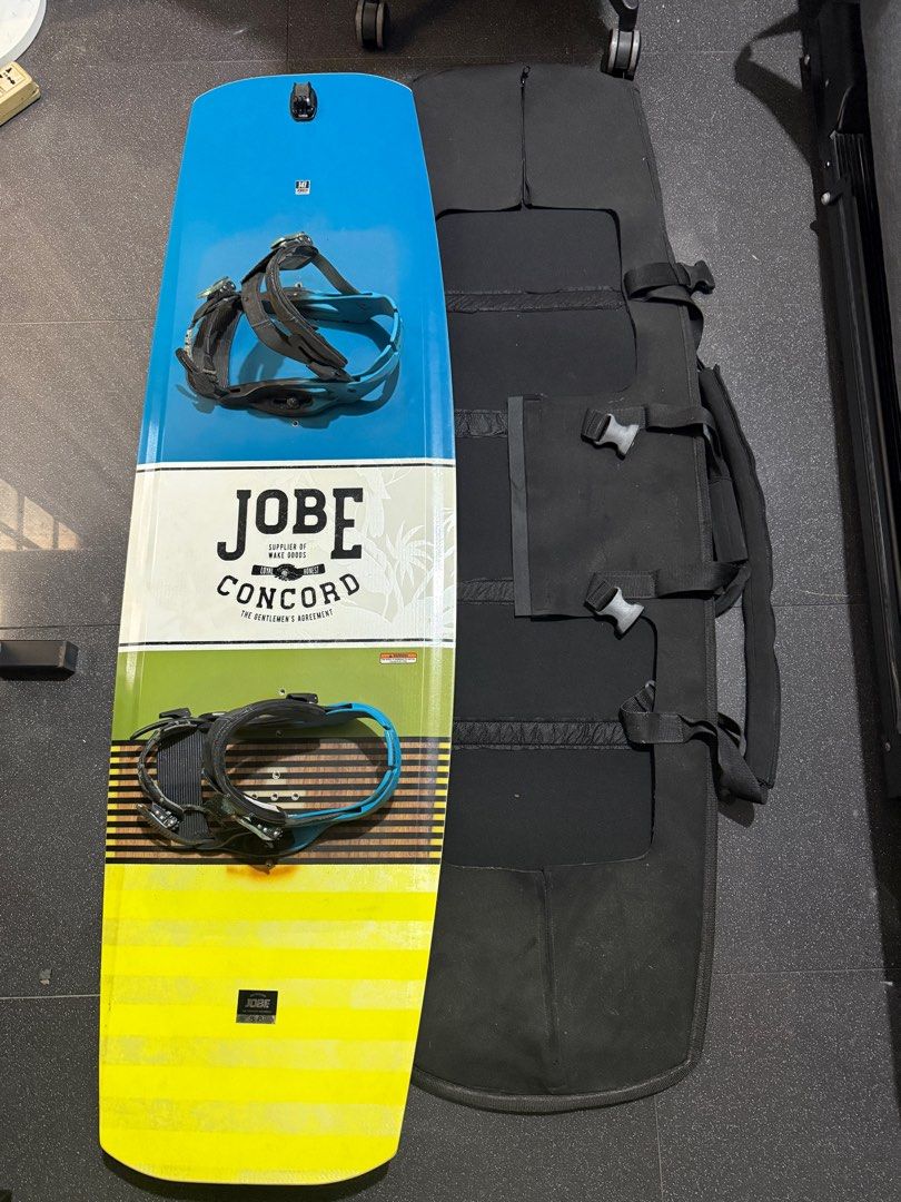 Jobe Concord Wakeboard with Bag (Category: Water Sports) located in Makati City. Submitted by technmd7 (Listing ID 1417034071, Image 1). Description: - Jobe Concord wakeboard - Size 137cm - Includes bindings (need toe strap replacement) and carrying bag - Board design: Blue, white, and yellow - Bindings: Black with blue accents - Bag: Black with multiple compartments and straps - No boots.