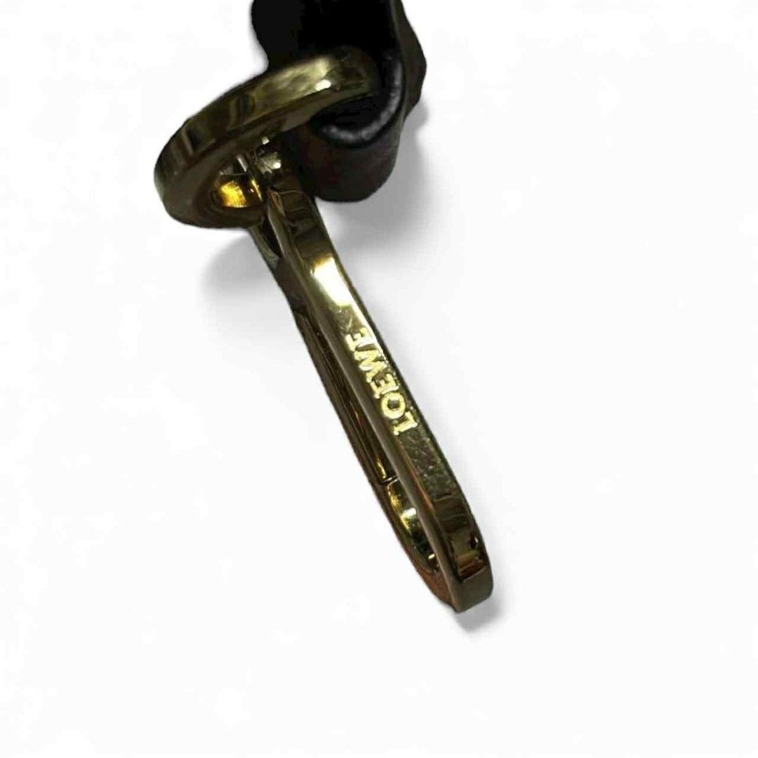 LOEWE Wide Leather Bag Strap – Black & Brown, Gold Hardware (authentic) (Category: Luxury Accessories) located in Cebu City. Submitted by westleygics18 (Listing ID 1417128138, Image 2). Description: LOEWE Wide Leather Bag Strap – Black & Brown, Gold Hardware (authentic) Excellent Condition Genuine leather Colors: Black strap with brown leather ends Hardware: Gold metal clasps with LOEWE engraving Width: 2 inches Length: 30 inches (end to end) Det