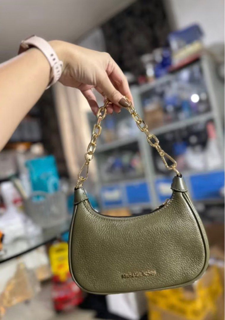Michael Kors Cora Mini Shoulder Bag (Category: Luxury Bags & Wallets) located in Dasmarinas. Submitted by jc072727 (Listing ID 1417033107, Image 3). Description: - Michael Kors Cora Mini Shoulder Bag - Stylish olive green color - Gold chain strap - Includes an additional adjustable strap - Secure zip closure - Small interior compartment - Original price tag attached - Compact and chic design.