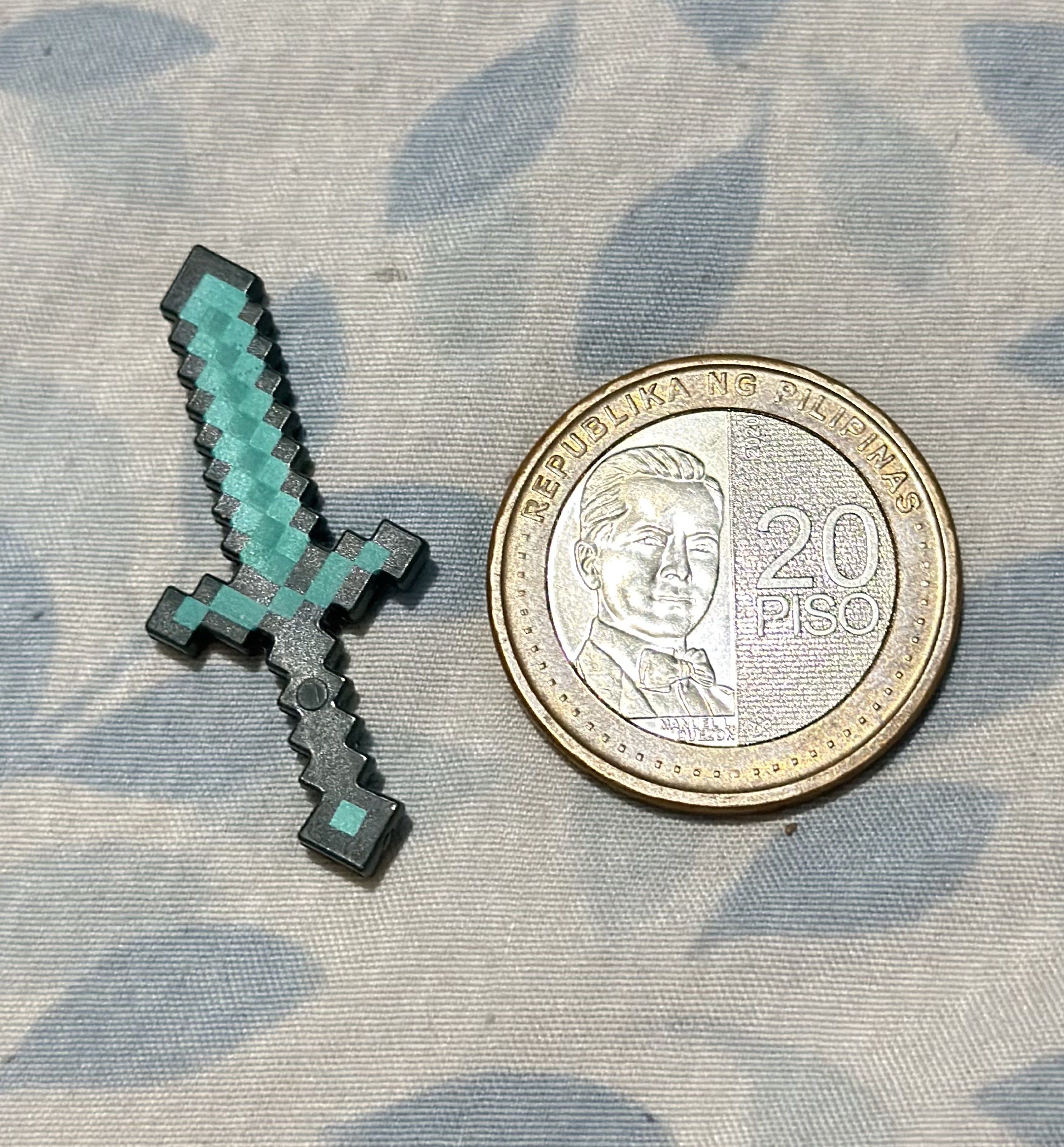 Minecraft Diamond Sword (Category: In-Game Products) located in General Santos City (Dadiangas). Submitted by toysville888 (Listing ID 1417068327, Image 2). Description: collectible Minecraft Diamond Sword The design is based on the in-game item from the popular video game Minecraft. It features the signature pixelated, blocky style of the game..