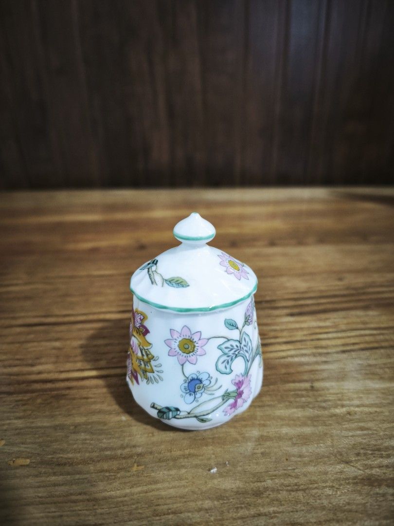 Minton Haddon Hall condiment pot (Category: Coffee & Tea Tableware) located in Baguio. Submitted by queenlyne_vintage_rare_finds (Listing ID 1417079592, Image 2). Description: Minton Haddon Hall sugar bowl. It features a white base with colorful floral patterns and a green trim. The lid has a small knob and a slot for a spoon. The bottom of the bowl is marked with the Minton logo and "Haddon Hall" and "Bone China Made in England". It measures app