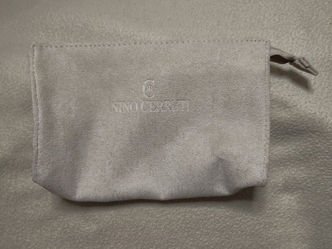 Nino Cerruti Pouch (Category: Luxury Bags & Wallets) located in Quezon City. Submitted by thriftstershop (Listing ID 1417187484, Image 1). Description: - Beige Nino Cerruti pouch - Zipper closure - Features a JAL tag - Made of soft, suede-like material Condition: 2ndhand - Very Good Meet up: Trinoma or Cubao Shipping via LBC.