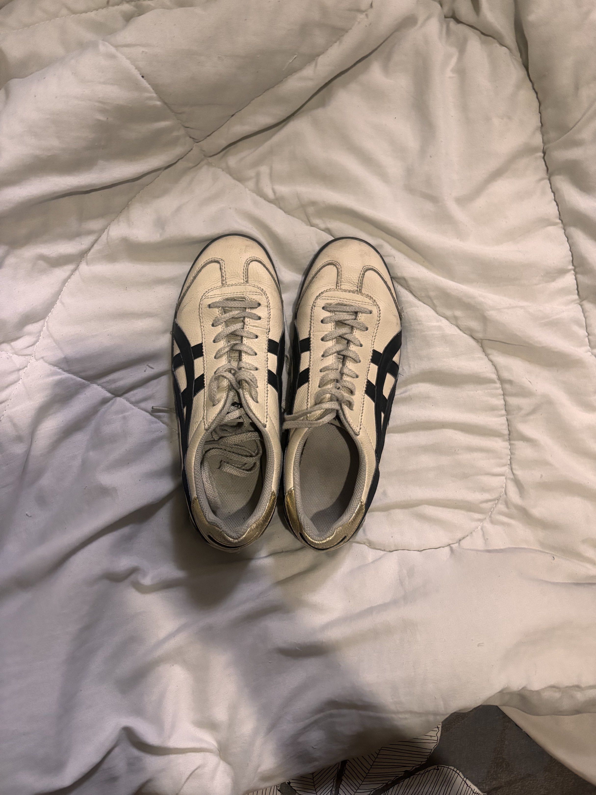 Onitsuka Tiger Mexico 66 Sneakers (Category: Casual Shoes) located in Paranaque City. Submitted by yawkonapo (Listing ID 1417065850, Image 2). Description: - Onitsuka Tiger Mexico 66 sneakers - Cream leather upper - Black stripes - Gold heel accents - Black soles - Lace-up closure - Retro design.