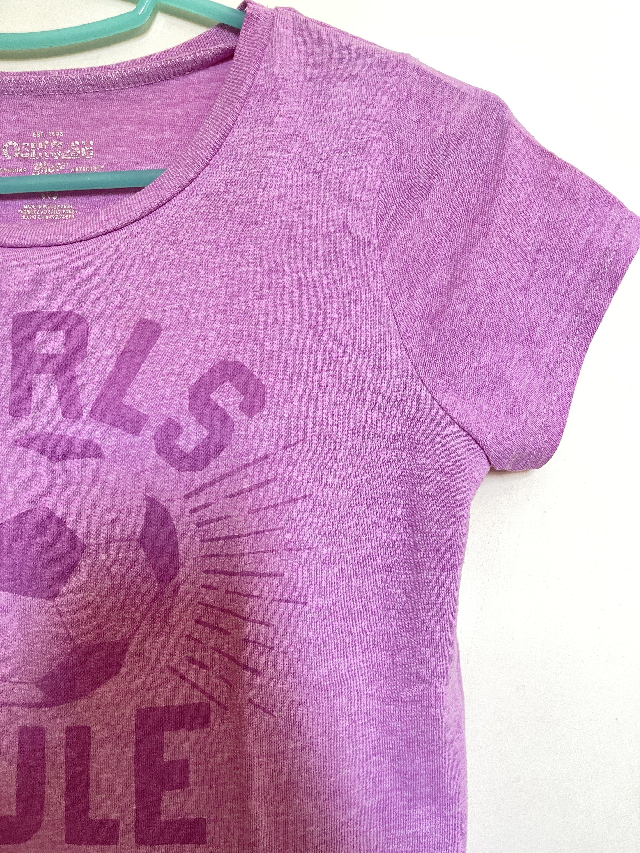 OshKosh - Kids T-shirt (Category: Babies & Kids Fashion) located in Manila. Submitted by closetlibraryph (Listing ID 1417090885, Image 3). Description: - OshKosh Girls Rule soccer graphic - Purple, short-sleeved shirt - Crew neck design - Soft and comfortable fabric - Casual wear appropriate - OshKosh brand visible.