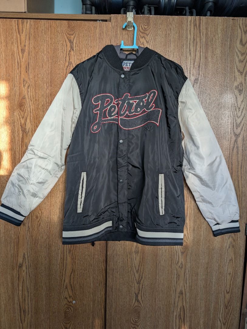 Petrol 1970 Varsity Jacket - XL (Category: Coats, Jackets and Outerwear) located in Quezon City. Submitted by trainforless (Listing ID 1417138064, Image 1). Description: - Petrol 1970 varsity jacket - Color: Black and cream - Size: XL - Features a hood and button-up front - Petrol logo on the chest - Ribbed cuffs and hem - Made with premium utilitarian denim.