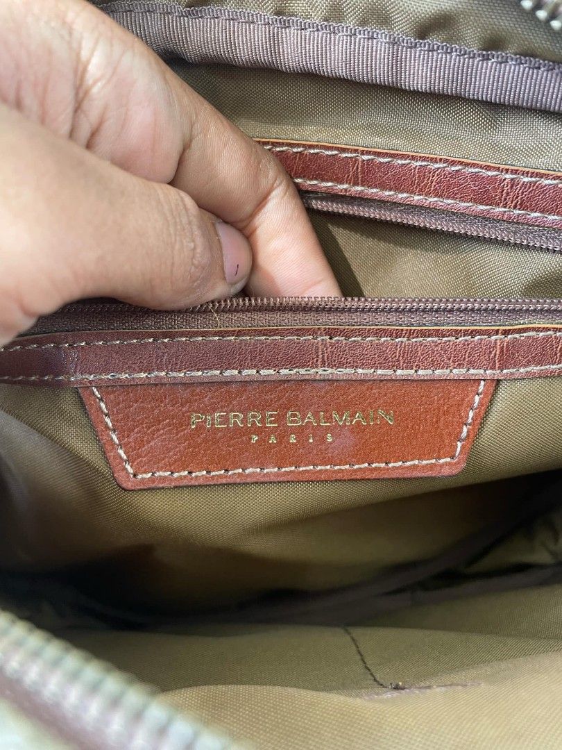 Pierre Balmain Crossbody Bag (Category: Luxury Bags & Wallets) located in Ligao. Submitted by merjudioma64633 (Listing ID 1417216163, Image 3). Description: - Authentic Pierre Balmain crossbody bag - Color: Brown and olive green - Features: - Shoulder strap - Zipper closure - Interior details: - Pierre Balmain label - Maruem Made in Japan tag - Japan Luggage Association tag - Condition: Good.