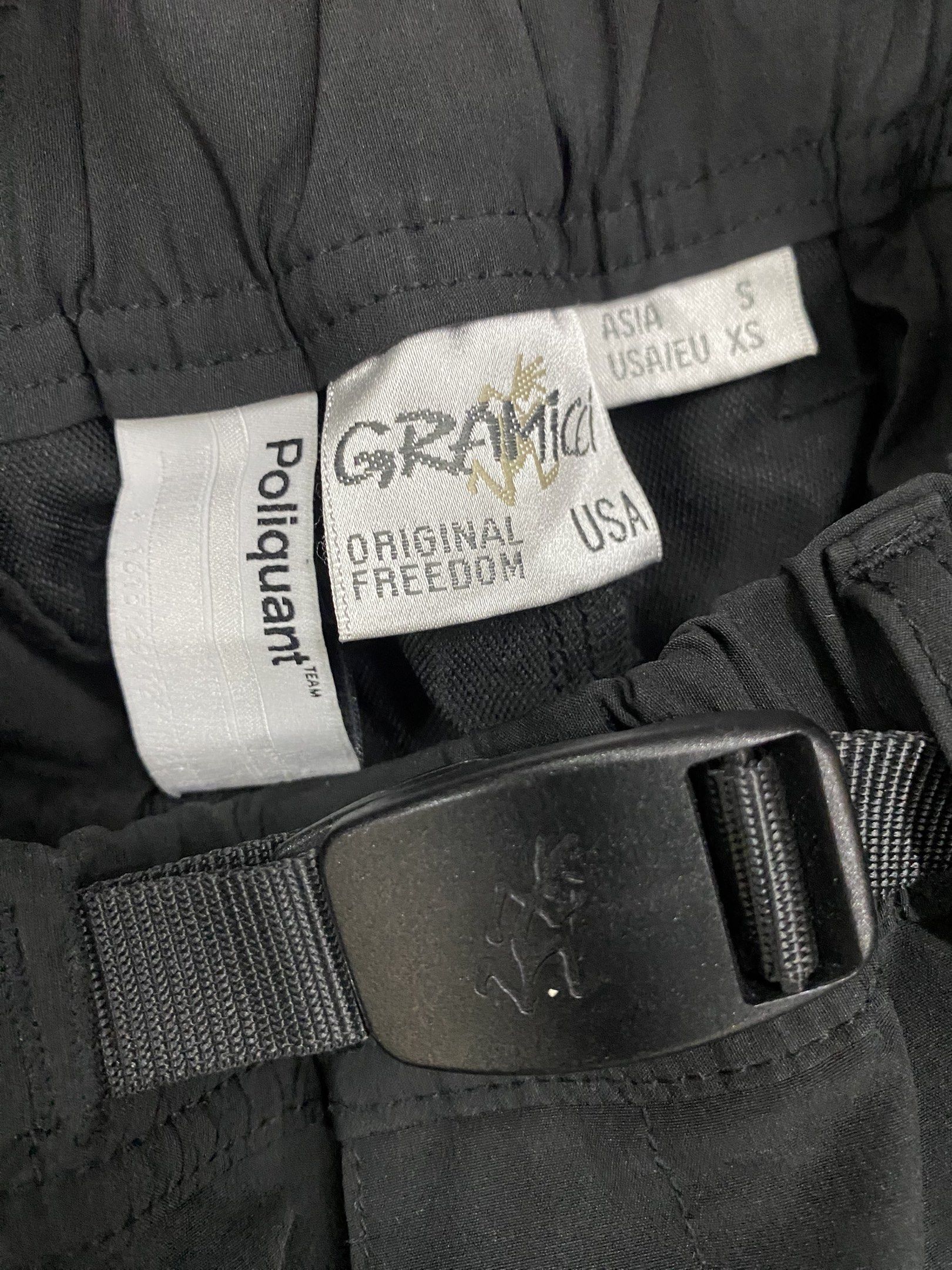 Poliquant x Gramicci GPG Functional Cargo Pants (Category: Trousers) located in Calapan. Submitted by yowstuff (Listing ID 1417068610, Image 3). Description: - Poliquant x Gramicci Black Cargo Pants - Size: Asia S / USA XS - Features: - Built-in belt with buckle - Multiple pockets - Elastic cuffs - Material: Nylon.