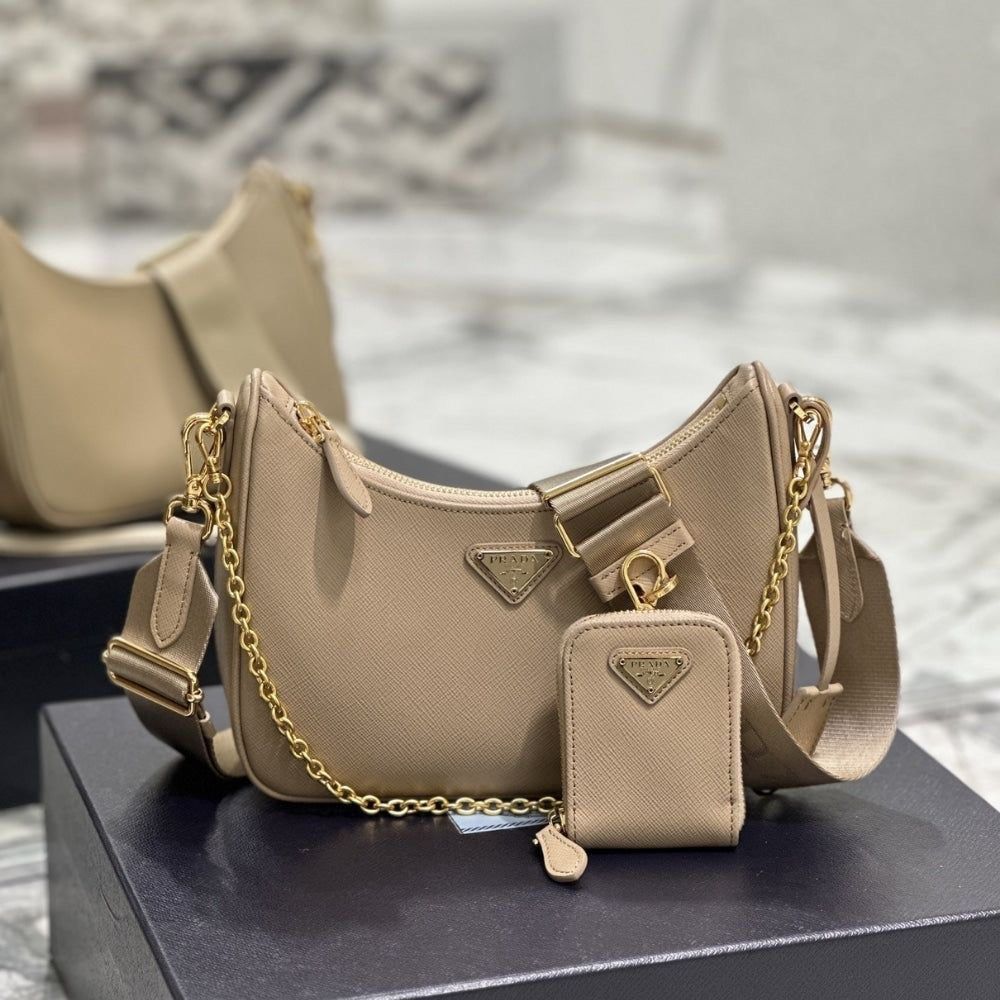 Prada Re-Edition 2005 Shoulder Bag (Category: Luxury Bags & Wallets) located in Cebu City. Submitted by missdestash (Listing ID 1417187623, Image 1). Description: Prada Re-Edition 2005 shoulder bag. Includes detachable pouch, gold chain, and adjustable strap. Textured material with Prada logo. Perfect for everyday use. Decluttering. DM for more info. .