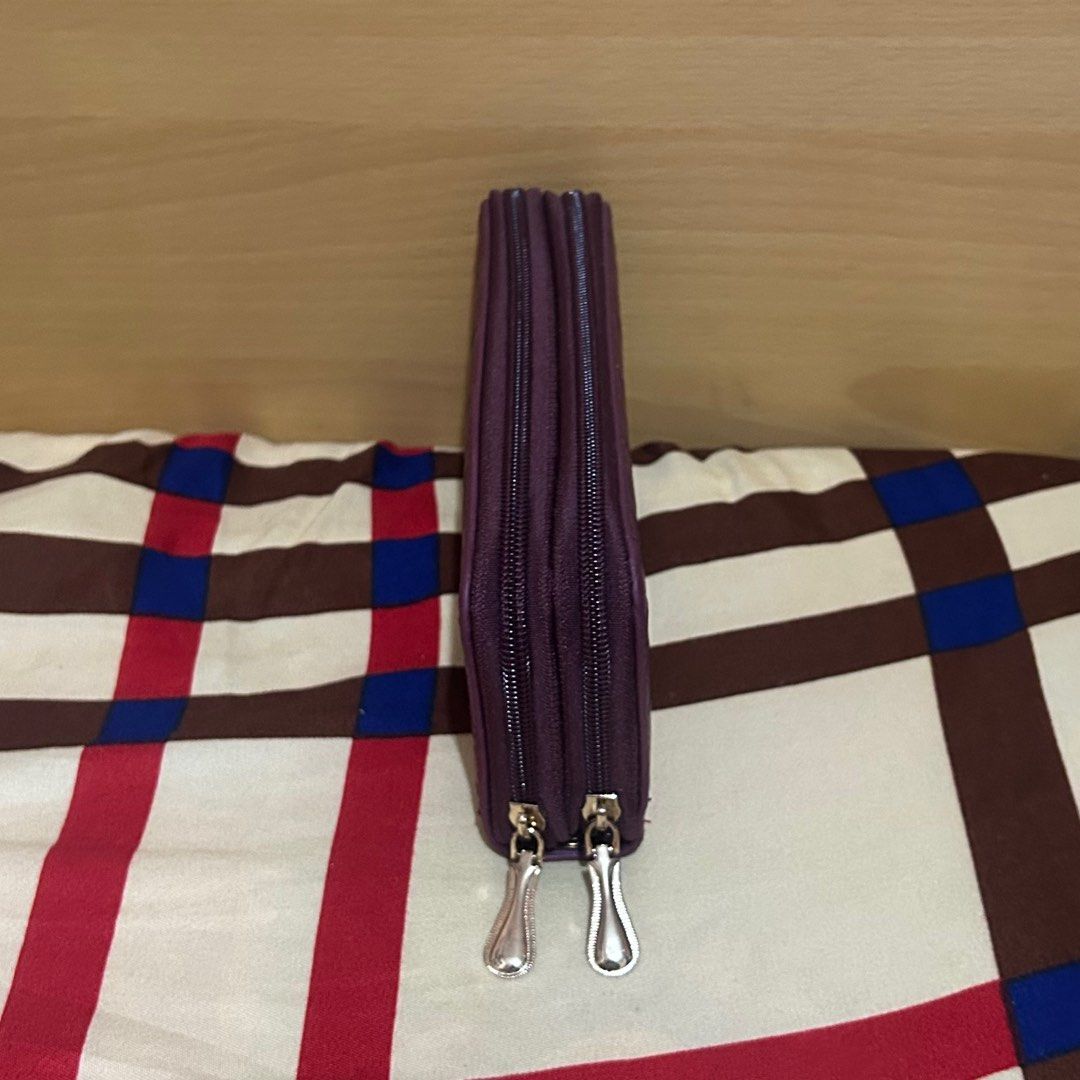 Purple Woven Zippered Wallet (Category: Wallets & Card holders) located in Manila. Submitted by unfilteredfiles (Listing ID 1417203229, Image 2). Description: - Brand new purple wallet - Woven design - Double zipper closure - Multiple card and cash compartments - Includes wrist strap - Light pink interior lining - Small zippered pocket inside.
