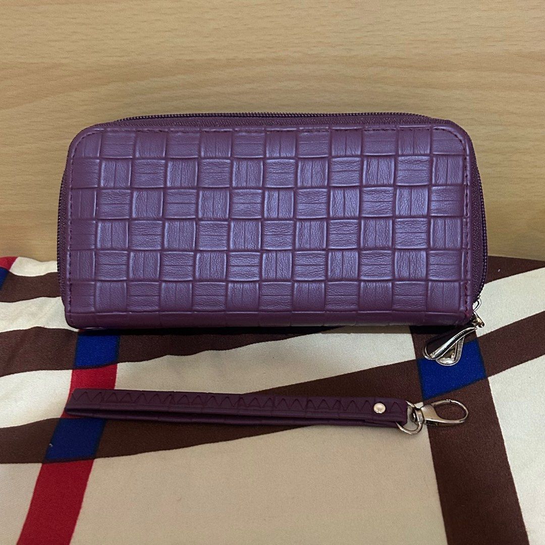 Purple Woven Zippered Wallet (Category: Wallets & Card holders) located in Manila. Submitted by unfilteredfiles (Listing ID 1417203229, Image 3). Description: - Brand new purple wallet - Woven design - Double zipper closure - Multiple card and cash compartments - Includes wrist strap - Light pink interior lining - Small zippered pocket inside.