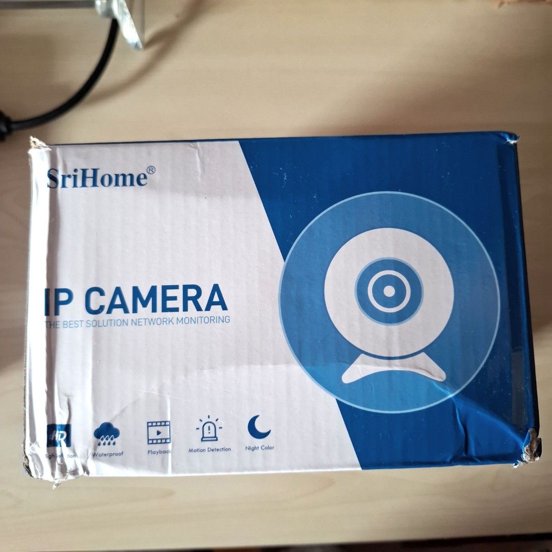 SriHome SH052 IP camera (Category: Security Systems & CCTV Cameras) located in Quezon City. Submitted by ana-chan (Listing ID 1417060979, Image 2). Description: - SriHome SH052 IP Camera - 5MP HD Resolution - Night Color Vision - Two-Way Audio - Wi-Fi Enabled - Motion Detection - SD Card Recording - Remote View - Auto Tracking - Pan & Tilt Rotation - Waterproof - Red & Blue Light Alarm - Includes Camera, Power Adapter, Manual, and Screw Bag.