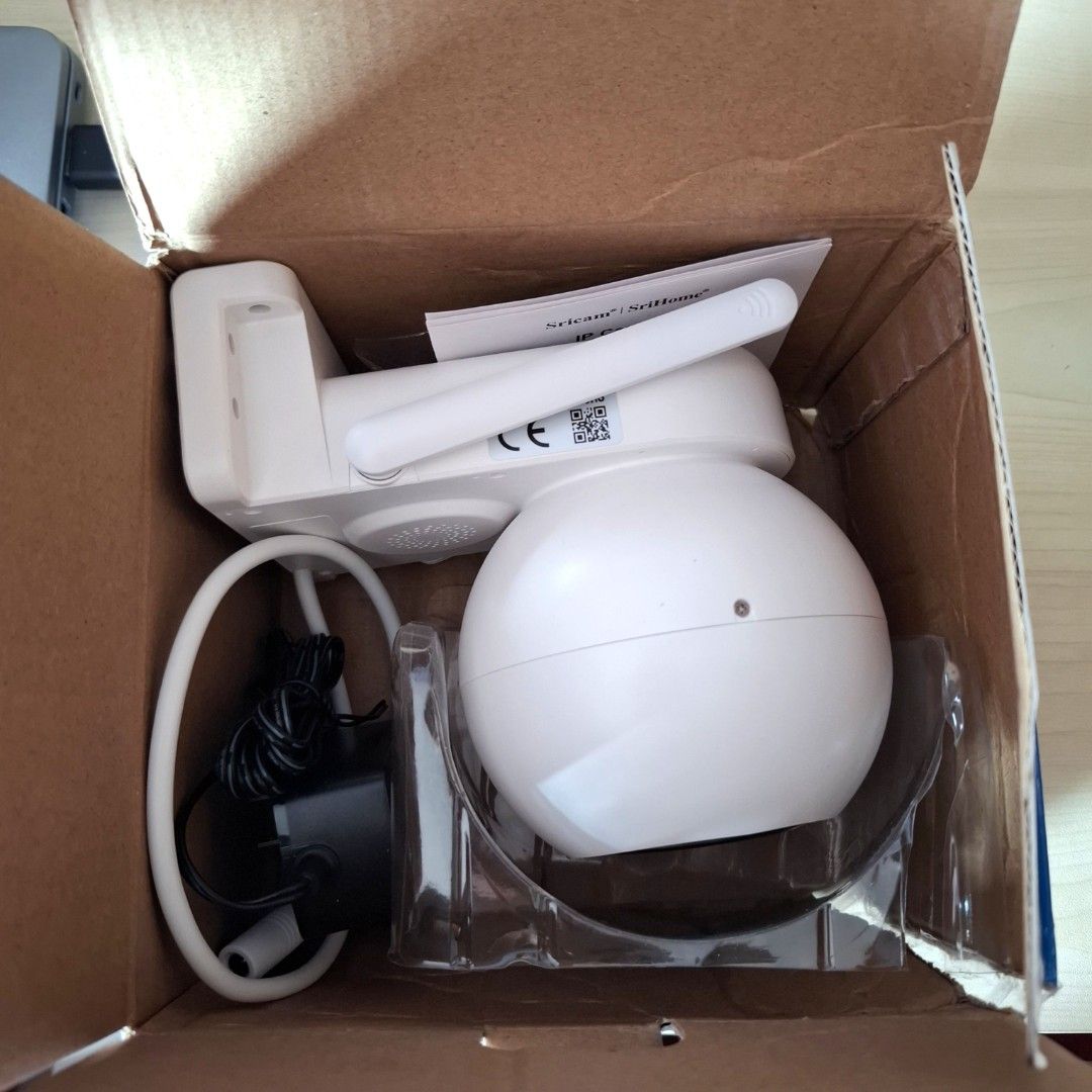 SriHome SH052 IP camera (Category: Security Systems & CCTV Cameras) located in Quezon City. Submitted by ana-chan (Listing ID 1417060979, Image 1). Description: - SriHome SH052 IP Camera - 5MP HD Resolution - Night Color Vision - Two-Way Audio - Wi-Fi Enabled - Motion Detection - SD Card Recording - Remote View - Auto Tracking - Pan & Tilt Rotation - Waterproof - Red & Blue Light Alarm - Includes Camera, Power Adapter, Manual, and Screw Bag.