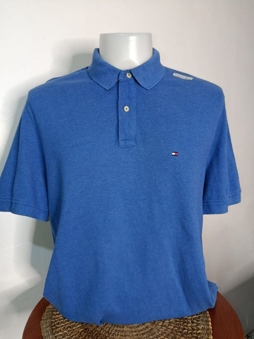 Tommy Hilfiger Blue Polo Shirt (Category: Tshirts & Polo Shirts ) located in Tabaco. Submitted by chicpolos (Listing ID 1417210574, Image 1). Description: - Authentic Tommy Hilfiger polo shirt - Vibrant blue color - Features the iconic Tommy Hilfiger logo - Classic polo collar and button closure - Comfortable fabric - Size: L -21-22 x 34.