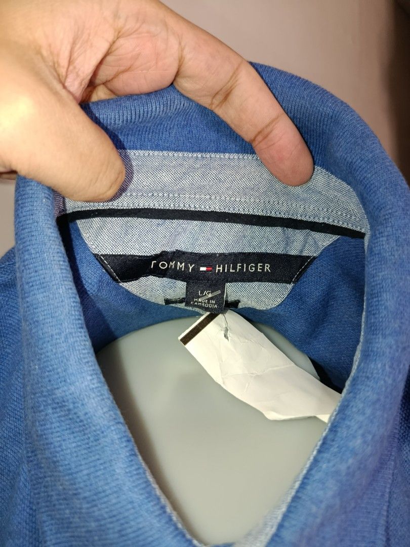 Tommy Hilfiger Blue Polo Shirt (Category: Tshirts & Polo Shirts ) located in Tabaco. Submitted by chicpolos (Listing ID 1417210574, Image 3). Description: - Authentic Tommy Hilfiger polo shirt - Vibrant blue color - Features the iconic Tommy Hilfiger logo - Classic polo collar and button closure - Comfortable fabric - Size: L -21-22 x 34.