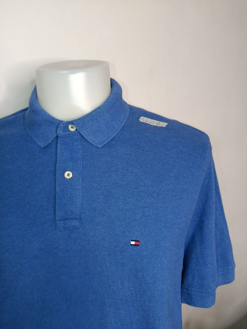Tommy Hilfiger Blue Polo Shirt (Category: Tshirts & Polo Shirts ) located in Tabaco. Submitted by chicpolos (Listing ID 1417210574, Image 2). Description: - Authentic Tommy Hilfiger polo shirt - Vibrant blue color - Features the iconic Tommy Hilfiger logo - Classic polo collar and button closure - Comfortable fabric - Size: L -21-22 x 34.