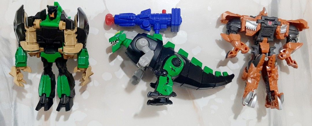 TRANSFORMERS GRIMLOCK (Category: Action & Battle Toys) located in Cebu City. Submitted by angelyneroberts_171329 (Listing ID 1417131155, Image 1). Description: FOR SALE TRANSFORMERS GRIMLOCK DESCRIPTION : - approximately 4 inches tall - one step transformation - basic figures CONDITION : - 9/10 - used for display only - loose/no box - what you see is what you get PRICE : p400 set of 3 pcs. PLUS SHIPPING FEE CROSS POSTED MOP : GCASH, PAYMENT FIRST