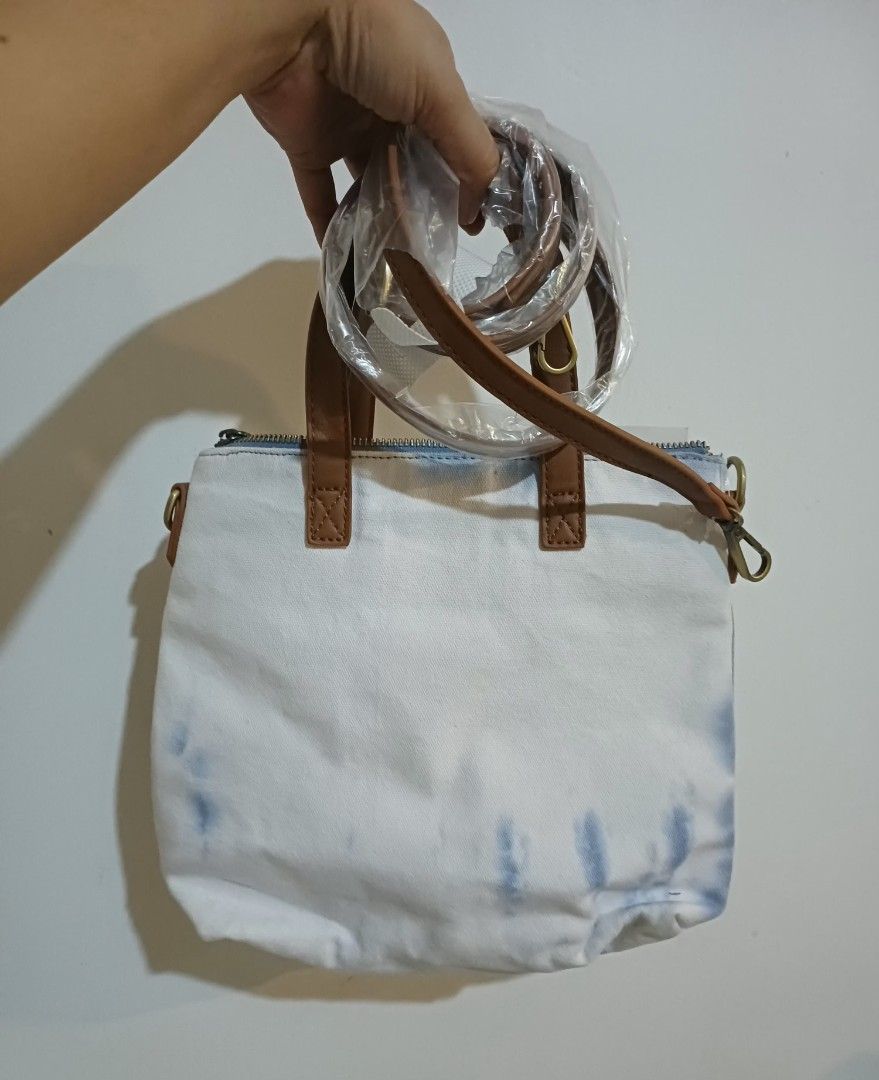 Urban Expressions Hazel Tote Bag (Category: Tote Bags) located in Gumaca. Submitted by m4ruh (Listing ID 1417182176, Image 3). Description: - Urban Expressions Hazel Tote Bag - Stylish tie-dye design - Brown leather handles - Detachable shoulder strap - Secure zipper closure - Spacious interior - Ideal for everyday use.